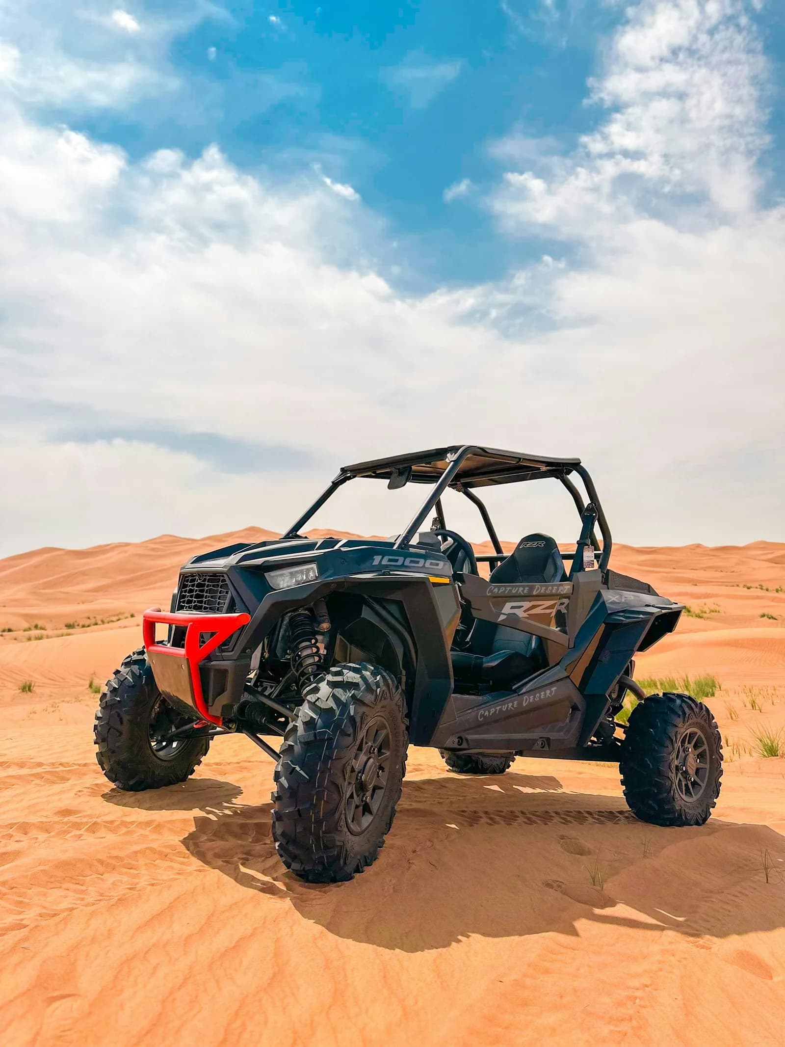 Kids dune buggy ride on a safe sandy track in the Dubai desert — photo 2