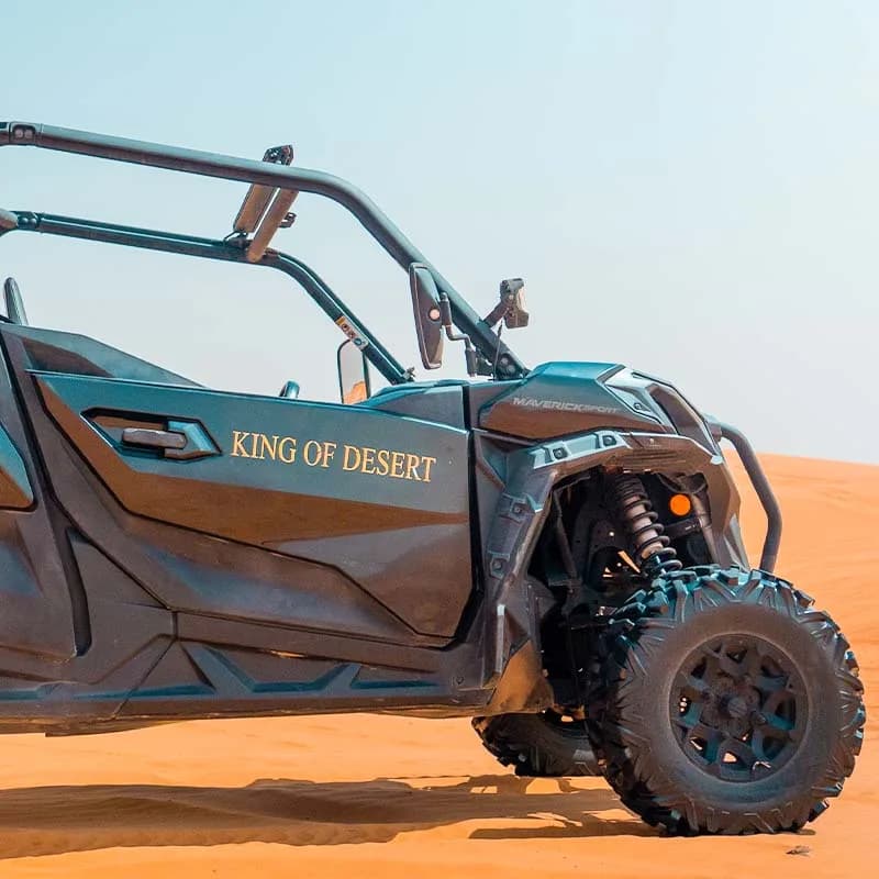 Can-Am Maverick Sport 4-seat dune buggy in the Dubai desert at golden hour — photo 2