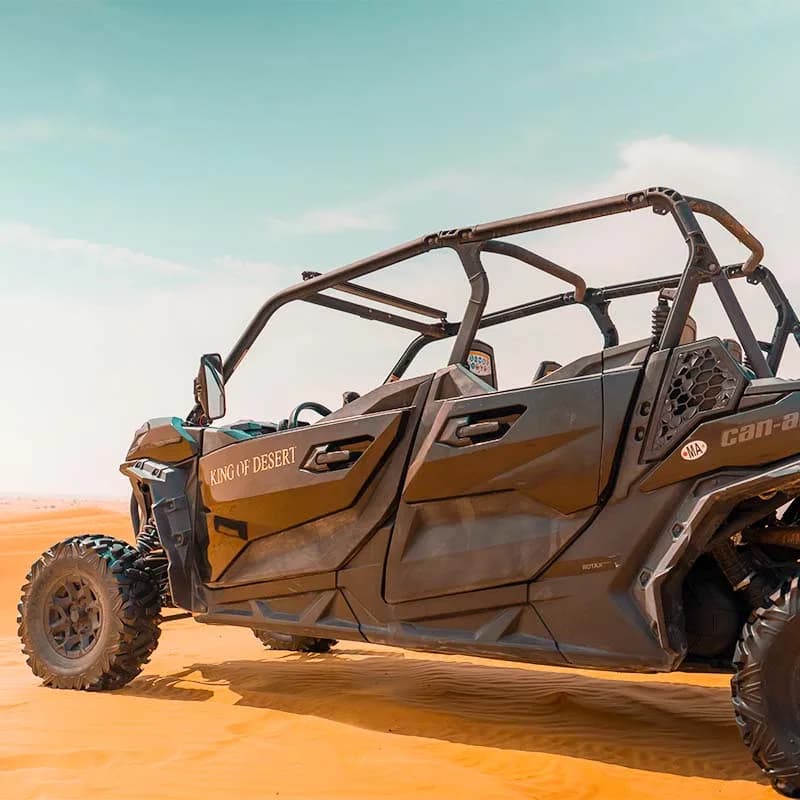 Can-Am Maverick Sport 4-seat dune buggy in the Dubai desert at golden hour — photo 4