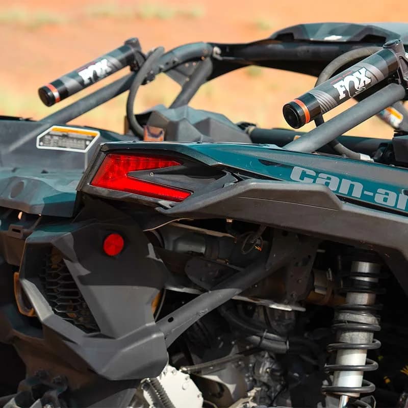 Can-Am X3 Turbo 2-seat dune buggy racing across Dubai desert dunes — photo 3