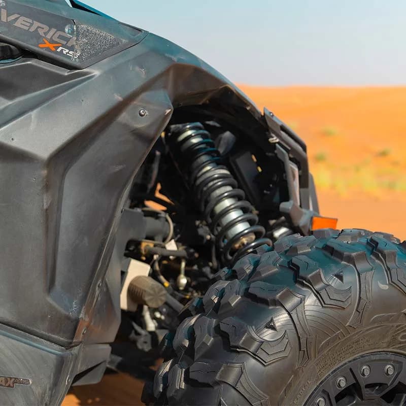 Can-Am X3 Turbo 2-seat dune buggy racing across Dubai desert dunes — photo 4