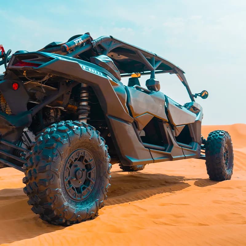 Can-Am X3 Turbo 4-seat dune buggy on the red dunes of the Dubai desert — photo 1