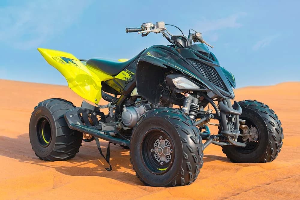 Yamaha 700 Raptor quad bike on the dunes of the Dubai desert