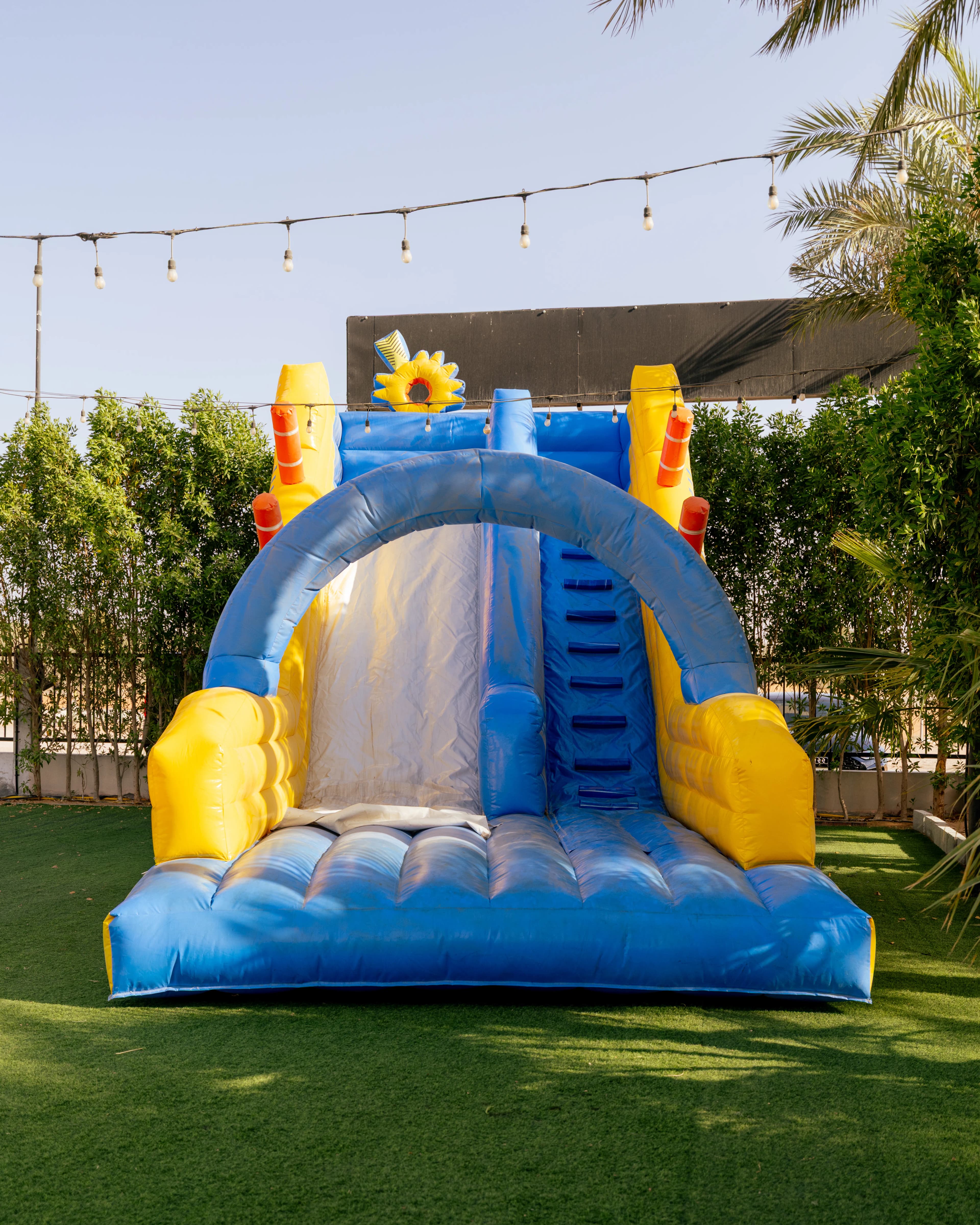 Inflatable play area for kids on the lawn at the desert camp