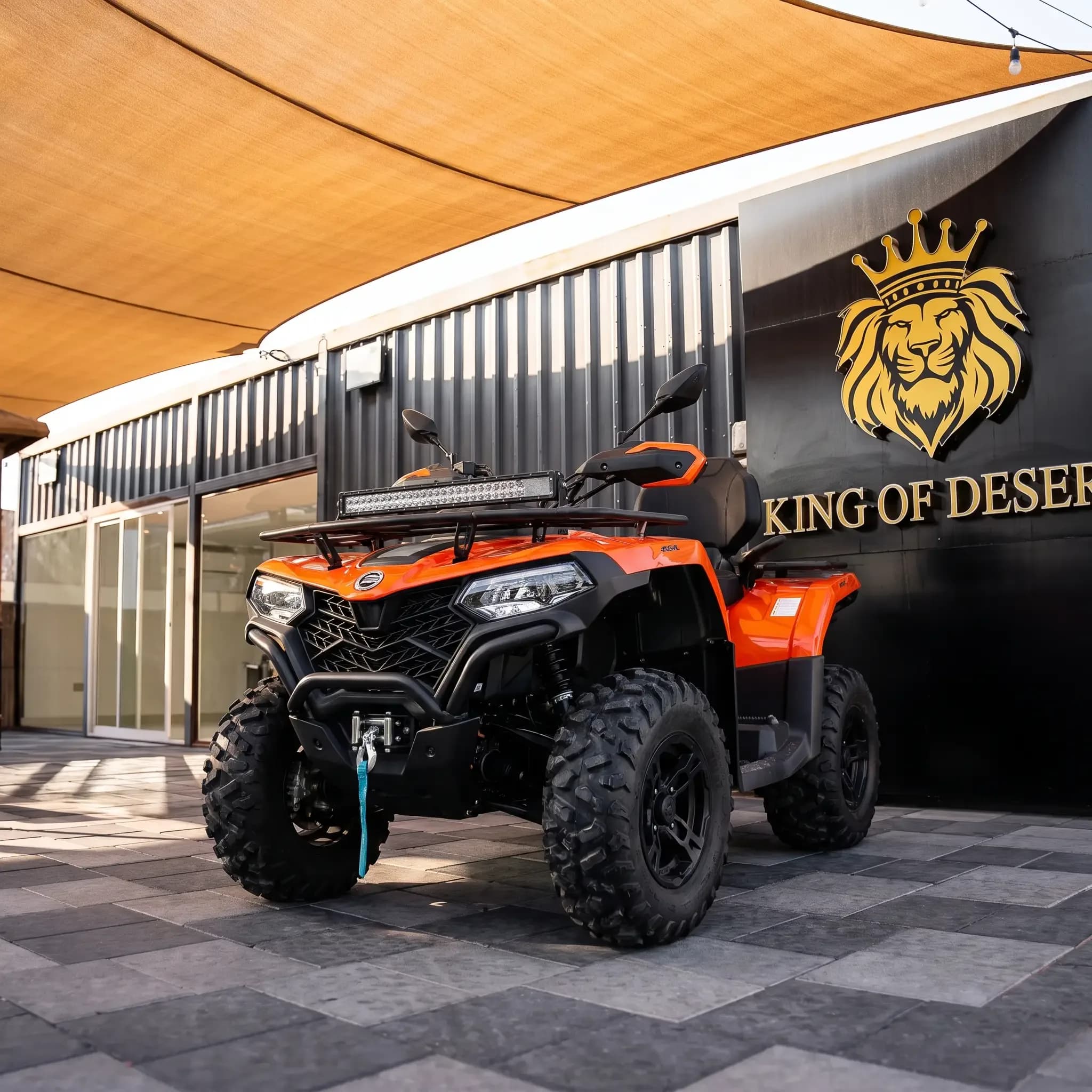 Orange CFMOTO CF450 quad bike on display outside the King of Desert showroom, Dubai